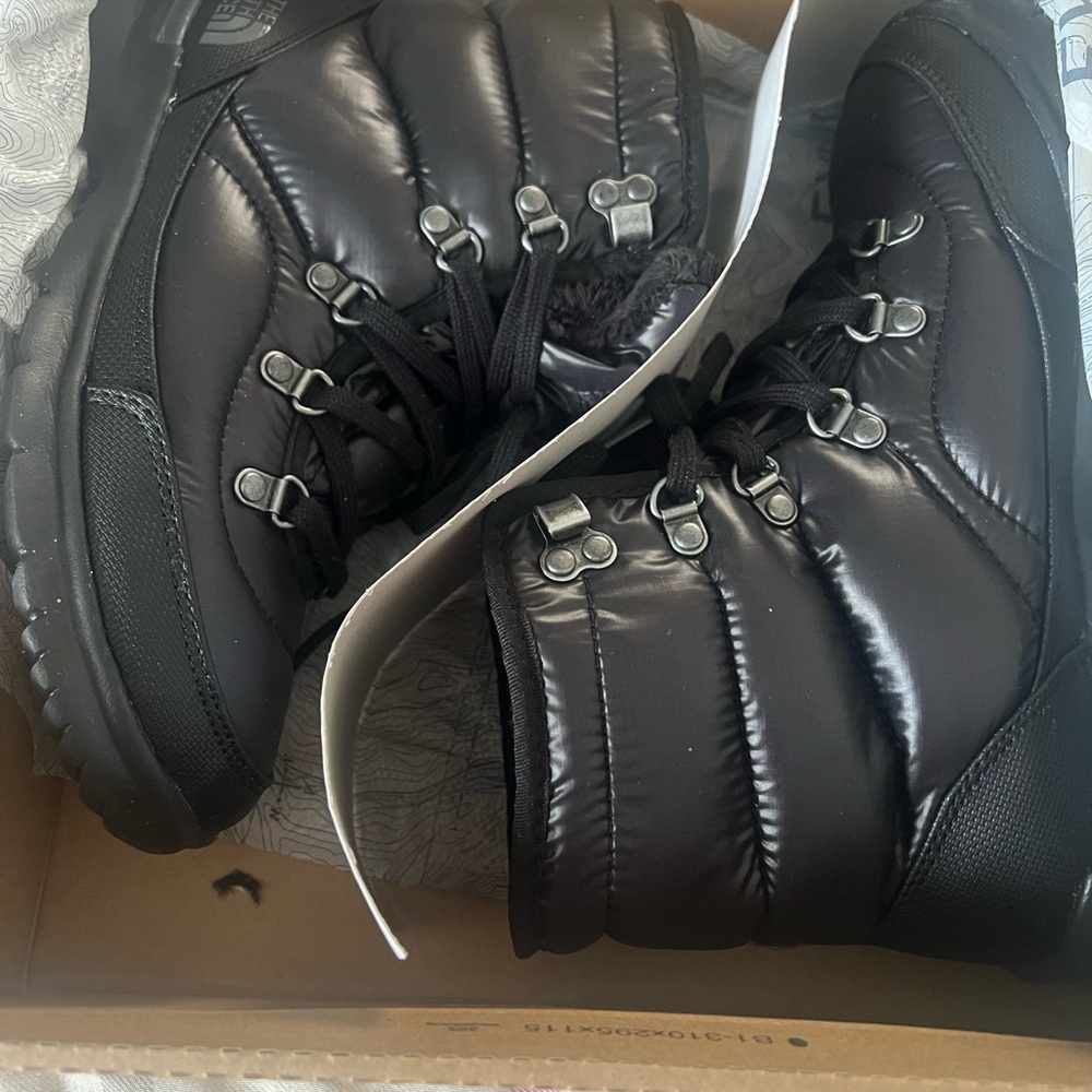 The North Face Black Boots with High-Top Design and Robust Sole